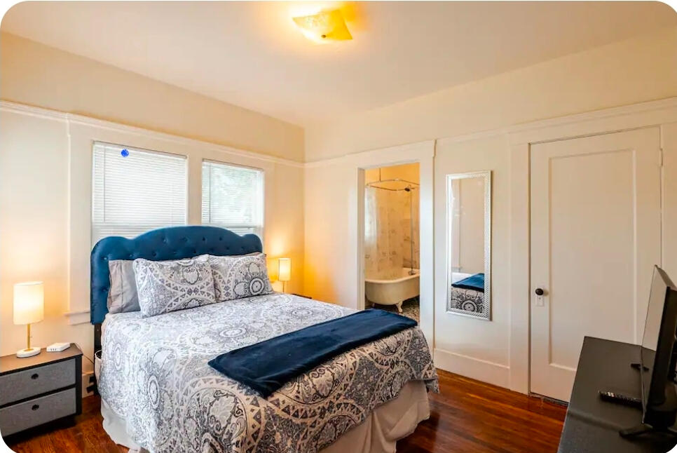 Comfortable bedroom in furnished extended stay rental in Vallejo CA with queen bed and fresh linens.”